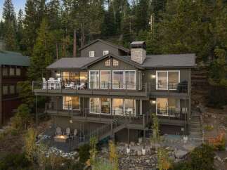 This multi-level home offers stunning views from its expansive decks, perfect for outdoor entertaining.