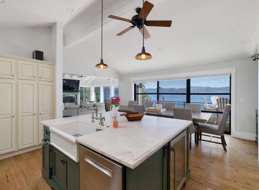 Experience breathtaking lake and mountain views from this stunning open-concept living space.