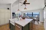 Experience breathtaking lake and mountain views from this stunning open-concept living space.