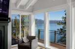 Experience breathtaking lake and mountain views from this stunning living space.