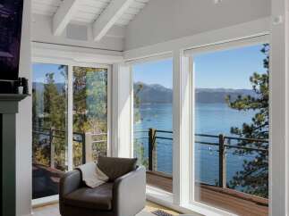 Experience breathtaking lake and mountain views from this stunning living space.