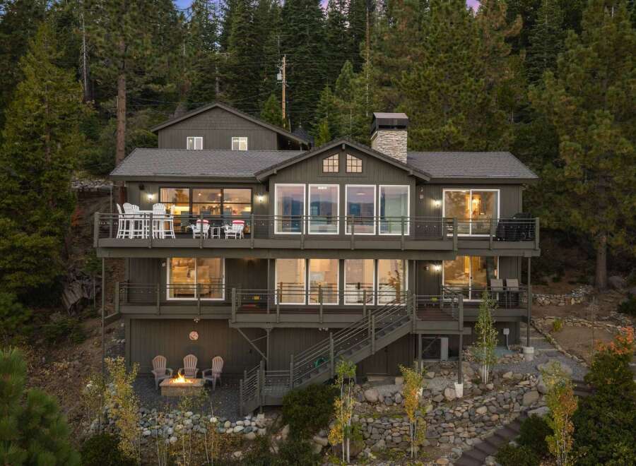 Experience luxury mountain living in this stunning multi-level home nestled among tall pine trees.