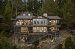 Experience luxury mountain living in this stunning multi-level home nestled among tall pine trees.