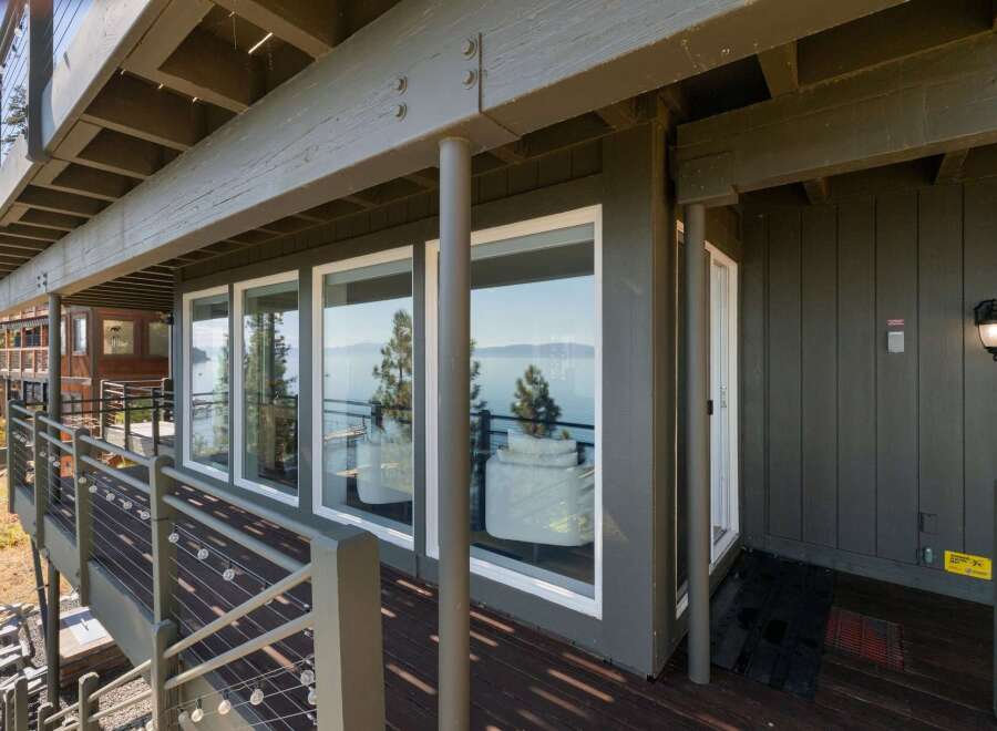 Enjoy breathtaking lake views from this stunning property, featuring expansive windows that bring the natural beauty indoors.