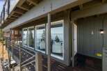 Enjoy breathtaking lake views from this stunning property, featuring expansive windows that bring the natural beauty indoors.