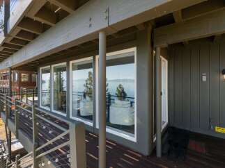 Enjoy breathtaking lake views from this stunning property, featuring expansive windows that bring the natural beauty indoors.