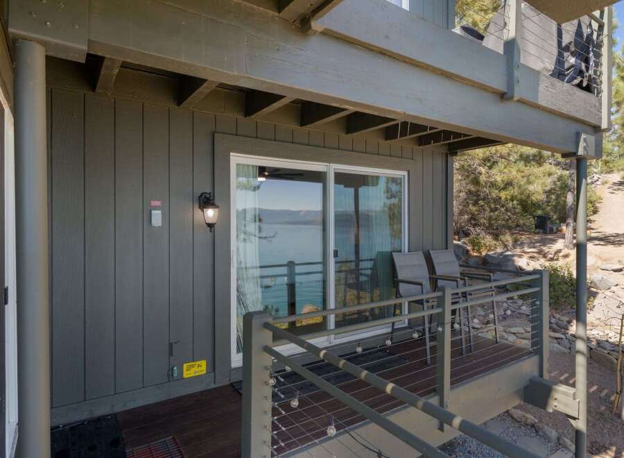 Enjoy breathtaking lake views from this charming property, featuring a spacious deck perfect for outdoor relaxation and entertaining.