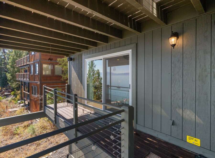Enjoy breathtaking lake views from this expansive deck, perfect for outdoor entertaining or quiet relaxation.