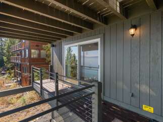 Enjoy breathtaking lake views from this expansive deck, perfect for outdoor entertaining or quiet relaxation.