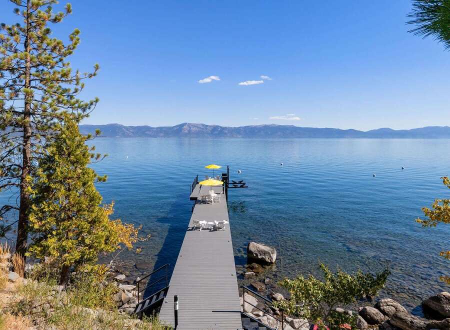Enjoy breathtaking lake views from this stunning property featuring a private dock perfect for swimming, sunbathing, or launching your watercraft.