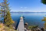 Enjoy breathtaking lake views from this stunning property featuring a private dock perfect for swimming, sunbathing, or launching your watercraft.