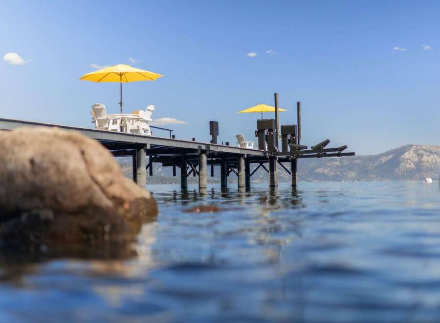 Enjoy the ultimate lakeside living with this stunning property featuring a private dock perfect for your boat and water toys.