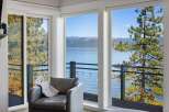 Experience breathtaking lake and mountain views from this stunning property, framed by large windows and a private balcony.