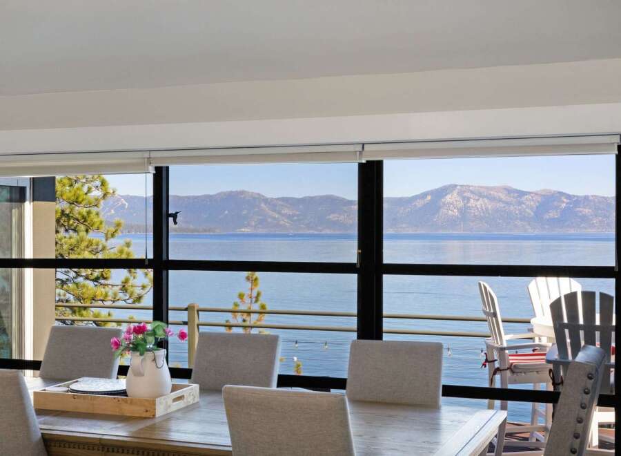 Experience breathtaking lake and mountain views from this stunning dining area, perfect for entertaining.