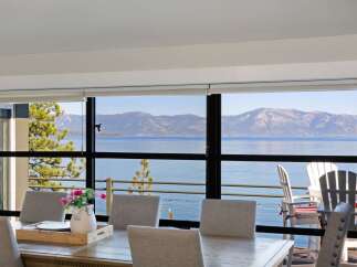 Experience breathtaking lake and mountain views from this stunning dining area, perfect for entertaining.