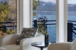 Experience breathtaking lake and mountain views from this stunning property.