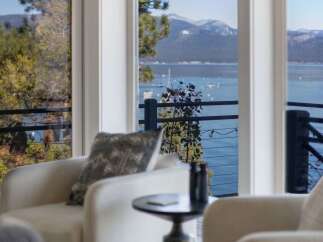 Experience breathtaking lake and mountain views from this stunning property.