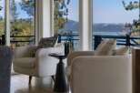 Experience breathtaking lake and mountain views from this stunning living space.