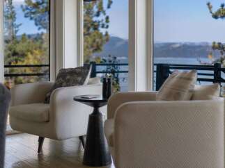 Experience breathtaking lake and mountain views from this stunning living space.