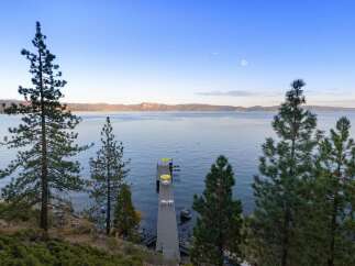 Experience serene lakefront living with this stunning property.
