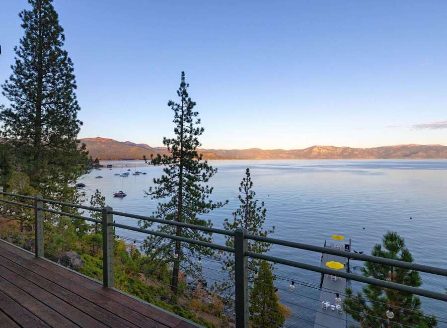 Experience breathtaking lake views from this stunning property, featuring a spacious deck perfect for entertaining or quiet relaxation.
