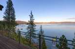Experience breathtaking lake views from this stunning property, featuring a spacious deck perfect for entertaining or quiet relaxation.