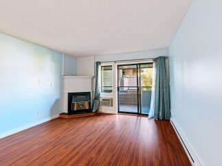 Step into this inviting living space featuring a cozy fireplace, perfect for chilly evenings.