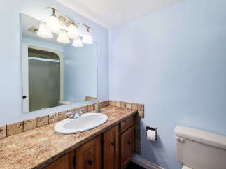 This bathroom features a light blue color scheme, creating a serene and airy atmosphere.