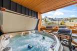 Enjoy ultimate relaxation with this luxurious hot tub, perfect for unwinding after a day of adventure.