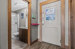 Step into this inviting space featuring a well-appointed bathroom with a modern vanity and a glass-enclosed shower.