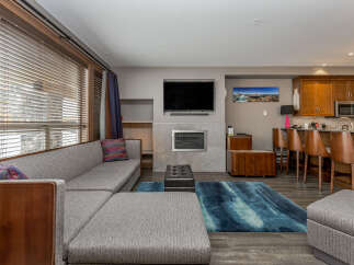 Experience modern comfort in this spacious living area, featuring a large sectional sofa perfect for relaxation and entertainment.