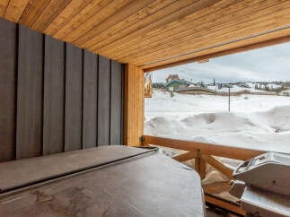 Enjoy a relaxing soak in the hot tub on your private deck, complete with a grill for outdoor entertaining.