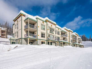 Experience luxury mountain living in this stunning condo, perfectly situated slopeside for unparalleled ski-in/ski-out access.
