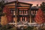 Experience luxury mountain living in this stunning modern home, featuring a striking wood and stone exterior that blends seamlessly with the natural landscape.