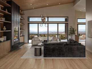 Experience breathtaking panoramic views from this stunning modern living room, featuring a sleek fireplace and expansive floor-to-ceiling windows.