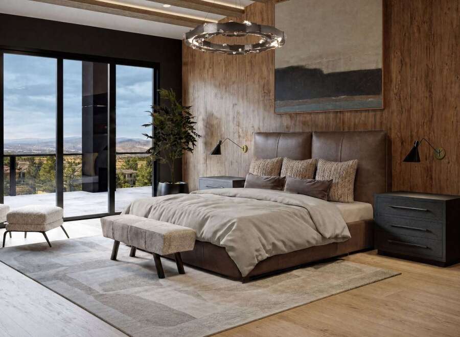 Experience luxury living in this master bedroom, featuring a king-size bed with a rich brown leather headboard and plush bedding.