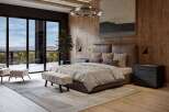 Experience luxury living in this master bedroom, featuring a king-size bed with a rich brown leather headboard and plush bedding.