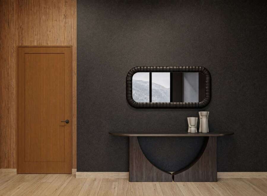 Discover modern elegance with this stunning entryway featuring a warm wood-paneled accent wall and a sleek, dark-toned door.