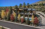 Experience luxury mountain living in this stunning contemporary home, nestled amidst vibrant autumn foliage.