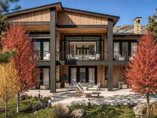 Experience luxury living in this modern mountain home, featuring a striking blend of natural wood and stone accents.