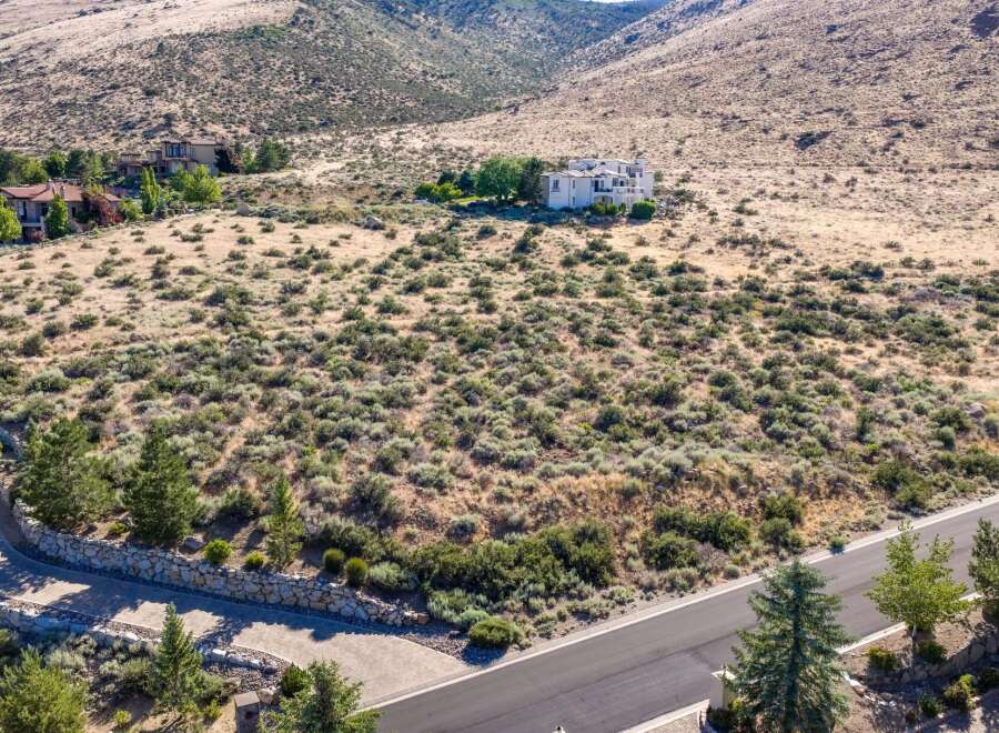 Discover this stunning estate nestled in a serene, arid landscape with panoramic views of rolling hills.