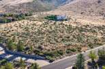 Discover this stunning estate nestled in a serene, arid landscape with panoramic views of rolling hills.