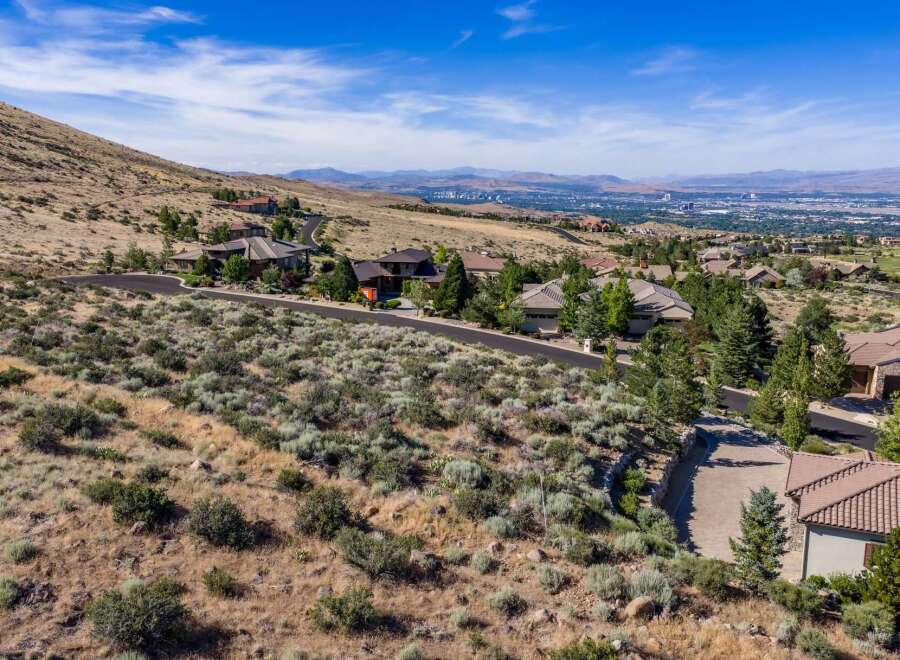 Experience luxury living in this stunning hillside estate, offering breathtaking panoramic views of the city and surrounding mountains.