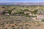 Experience luxury living in this stunning estate, nestled amidst rolling hills and offering breathtaking panoramic views of the valley and distant mountains.