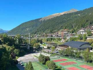 Experience breathtaking mountain views from this stunning property, nestled in a picturesque alpine village.