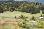 Discover this charming property nestled amidst a lush, autumnal forest.