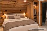 Experience rustic charm and modern comfort in this beautifully furnished bedroom.