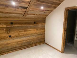 Experience rustic charm and modern comfort in this beautifully appointed room.
