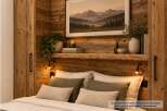 Experience rustic charm and modern comfort in this beautifully furnished bedroom.