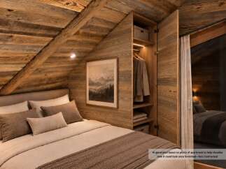 Experience rustic charm in this beautifully appointed bedroom, featuring a cozy bed adorned with plush pillows and a warm, textured throw.
